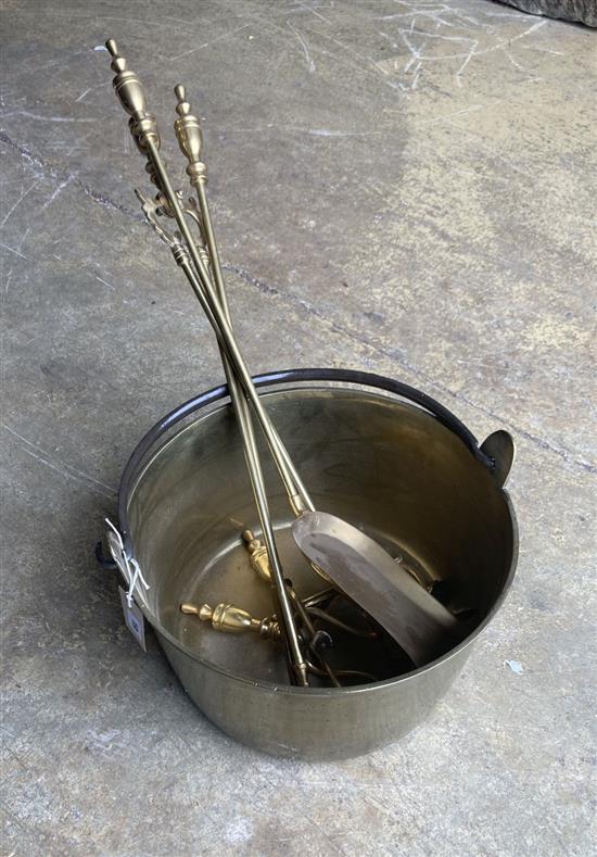 A Victorian brass preserve pan, diameter 36cm, a set of brass fire implements and a pair of fire dogs